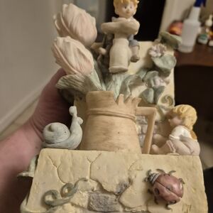 Charming Pastel Figurine with Flowers